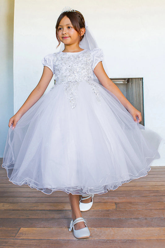 White communion dress featuring dimensional floral lace and a full tea-length skirt.