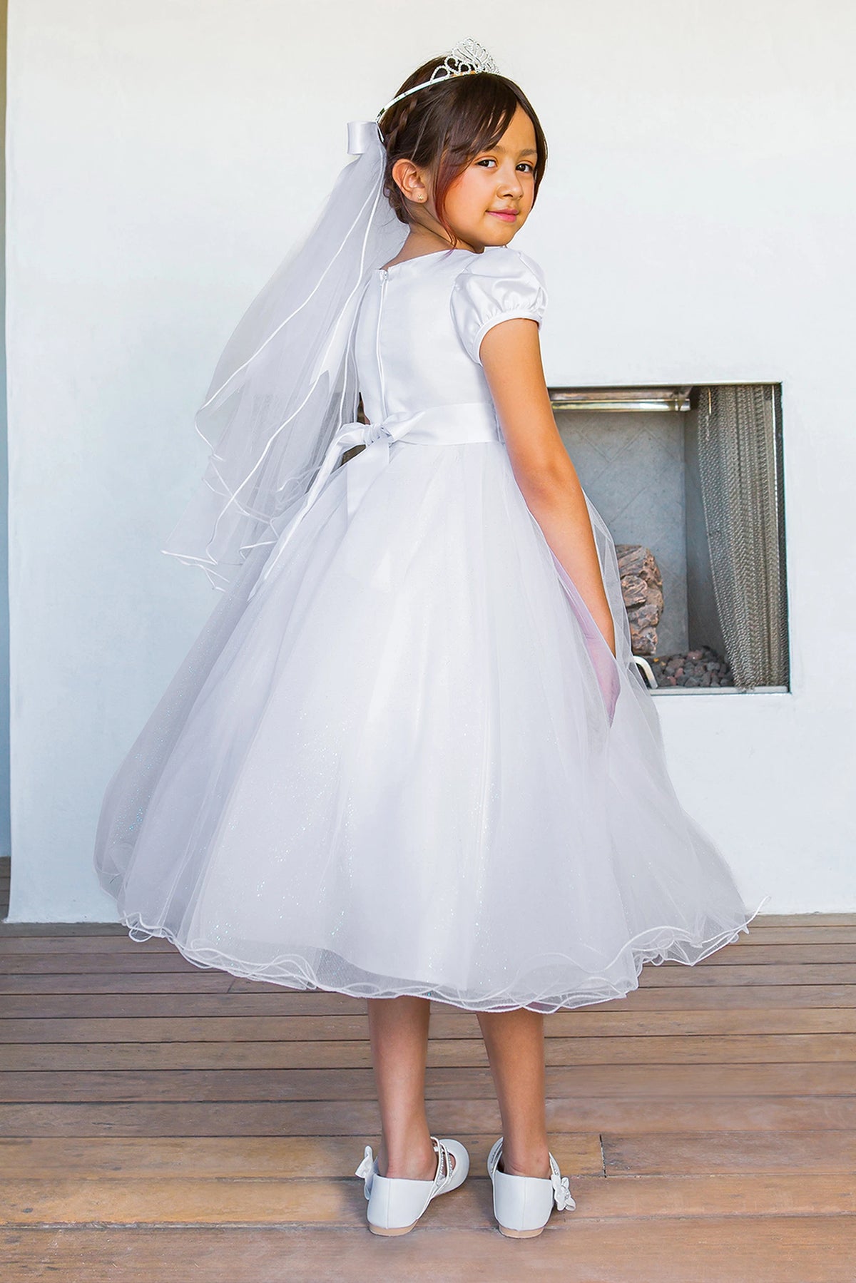 Back satin bow and zipper finish this White communion dress.