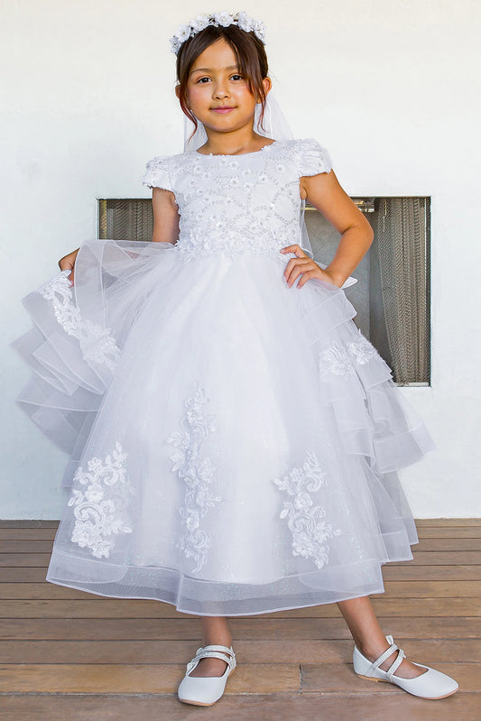 White communion dress with floral lace cascading over a tiered tulle skirt.