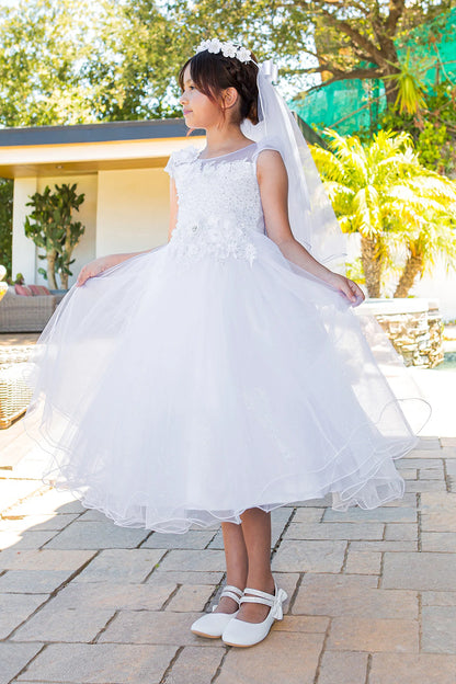 Cap sleeves and floral appliques frame the White communion dress bodice.