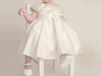 Ivory Flower Girl Beaded Short Sleeves Dull Satin dress with Detachable Pearl Sash - girl wearing dress sitting on chair