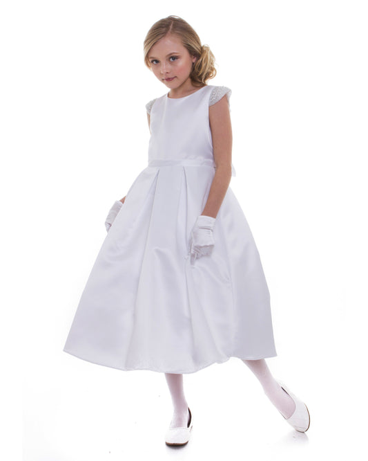 Young girl wearing a white dress on a white background