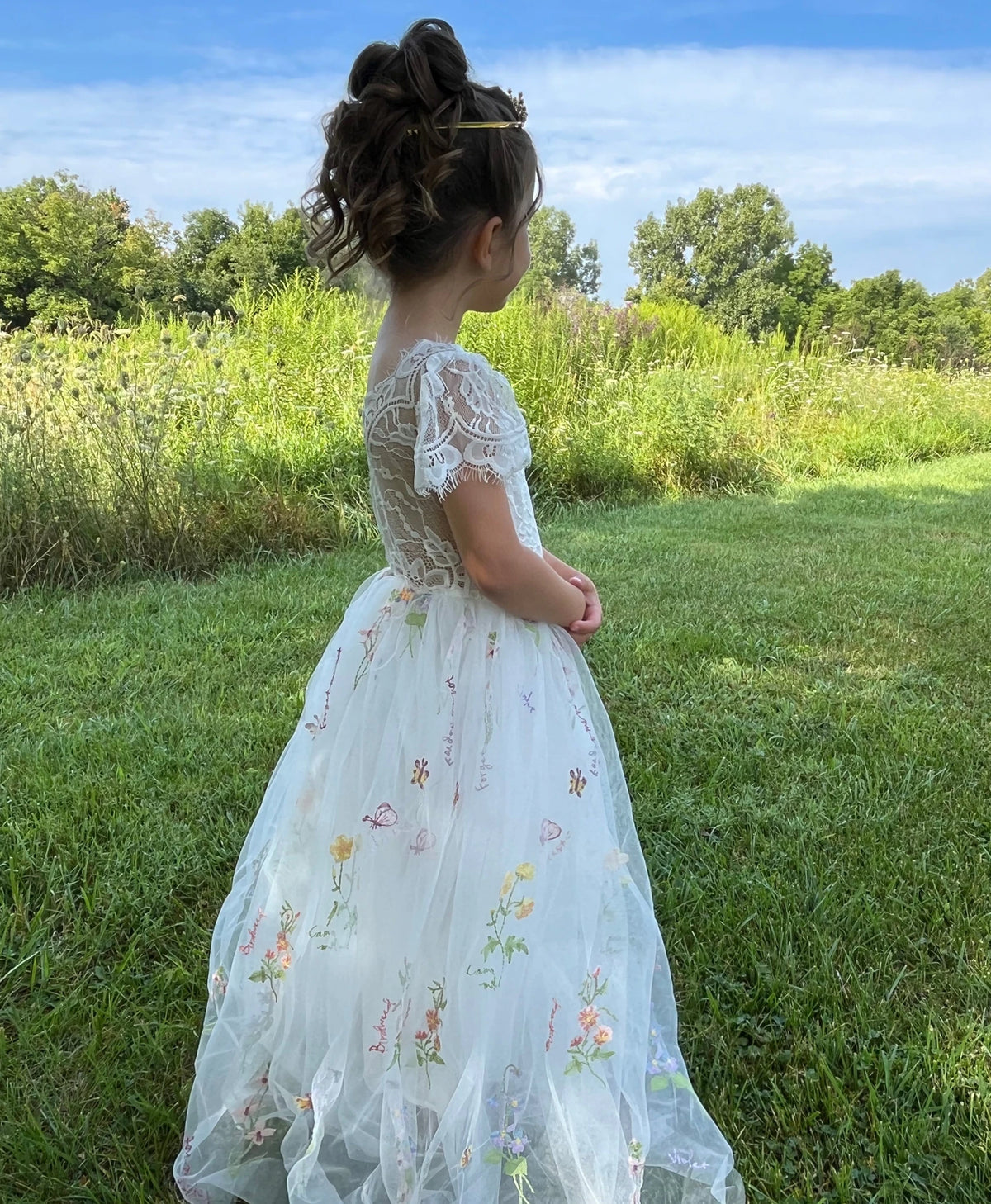 A white floral flower girl dress.