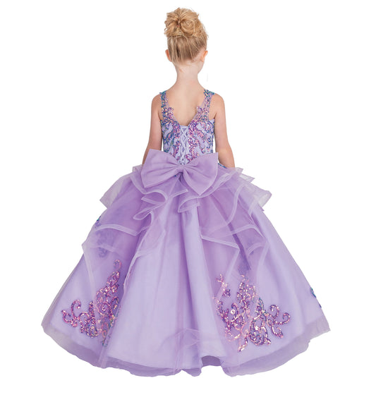 Lavender dress with floral embellishments and a large bow on a white background