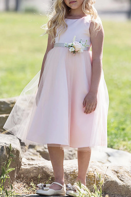 A pink flower girl dress with floral sash.