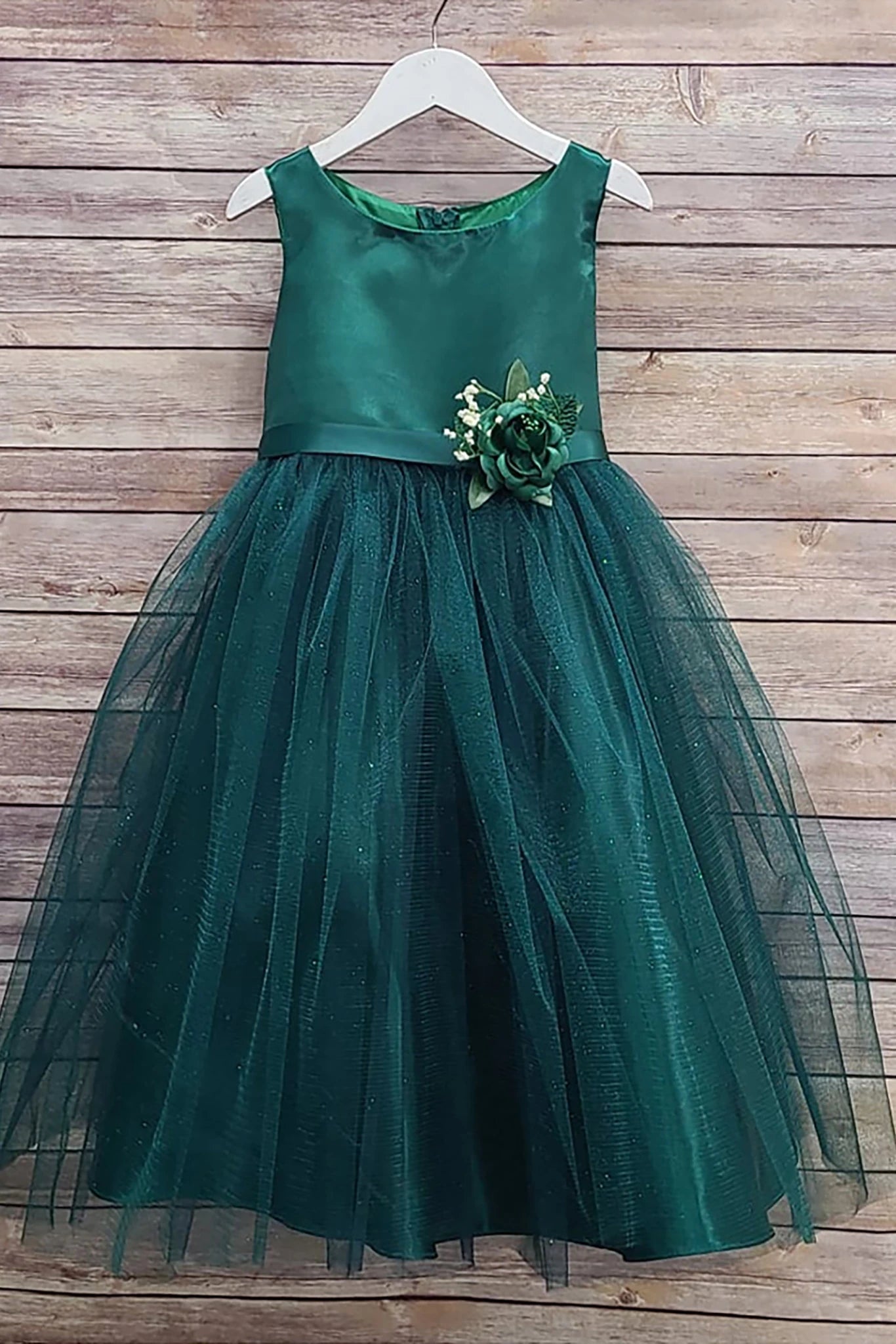 Green flower girl dress with floral detail.