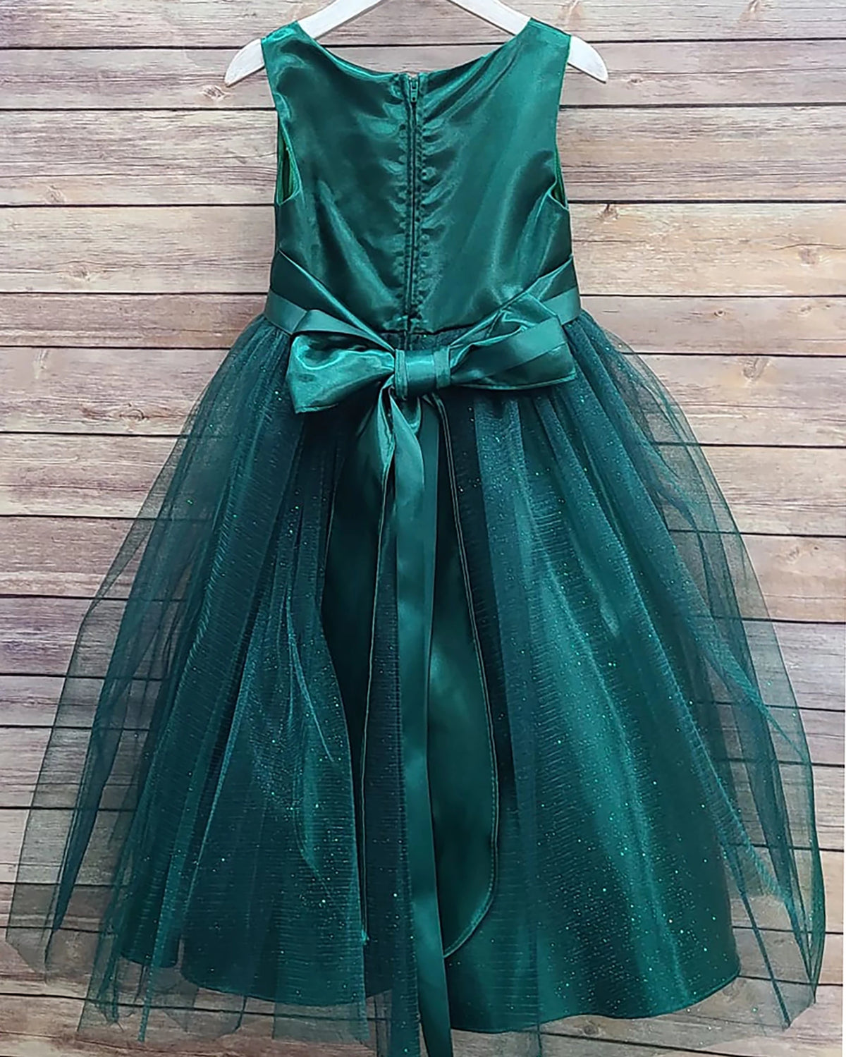 Green flower girl dress with a bow.