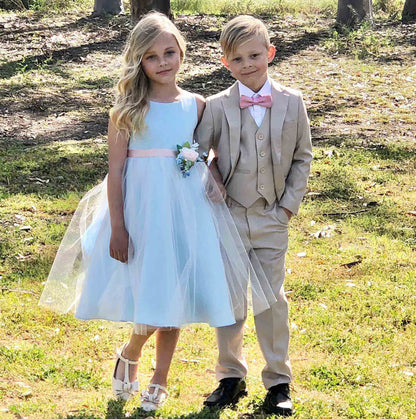 USA Made | Simple Dull Satin and Tulle dress with beautiful pin-on bouquet satin sash Flower Girl dress | 5 Colors Available - girl wearing dress standing next to boy