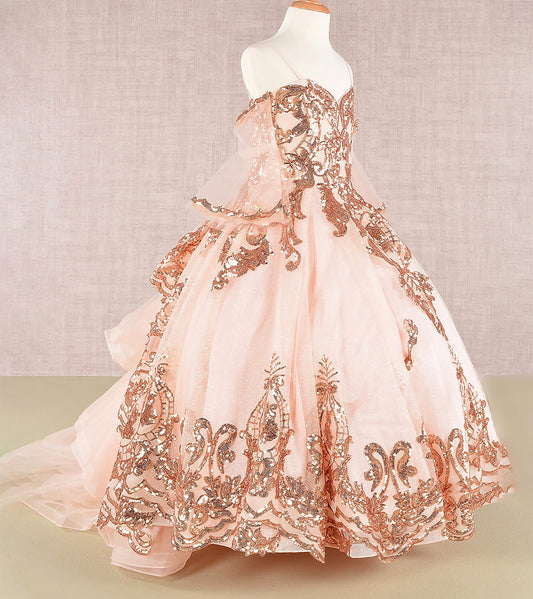 Elegant pink gown with rose gold embroidery on a mannequin against a neutral background