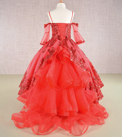 Red ball gown with floral embellishments on a mannequin against a neutral background