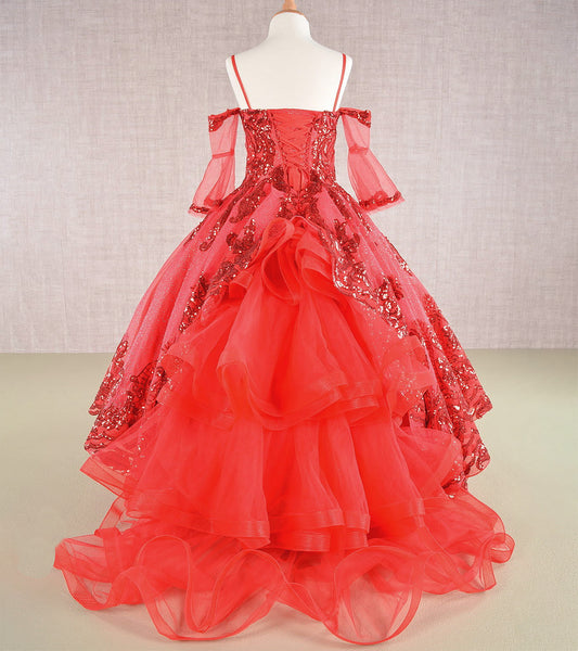 Red ball gown with floral embellishments on a mannequin against a neutral background