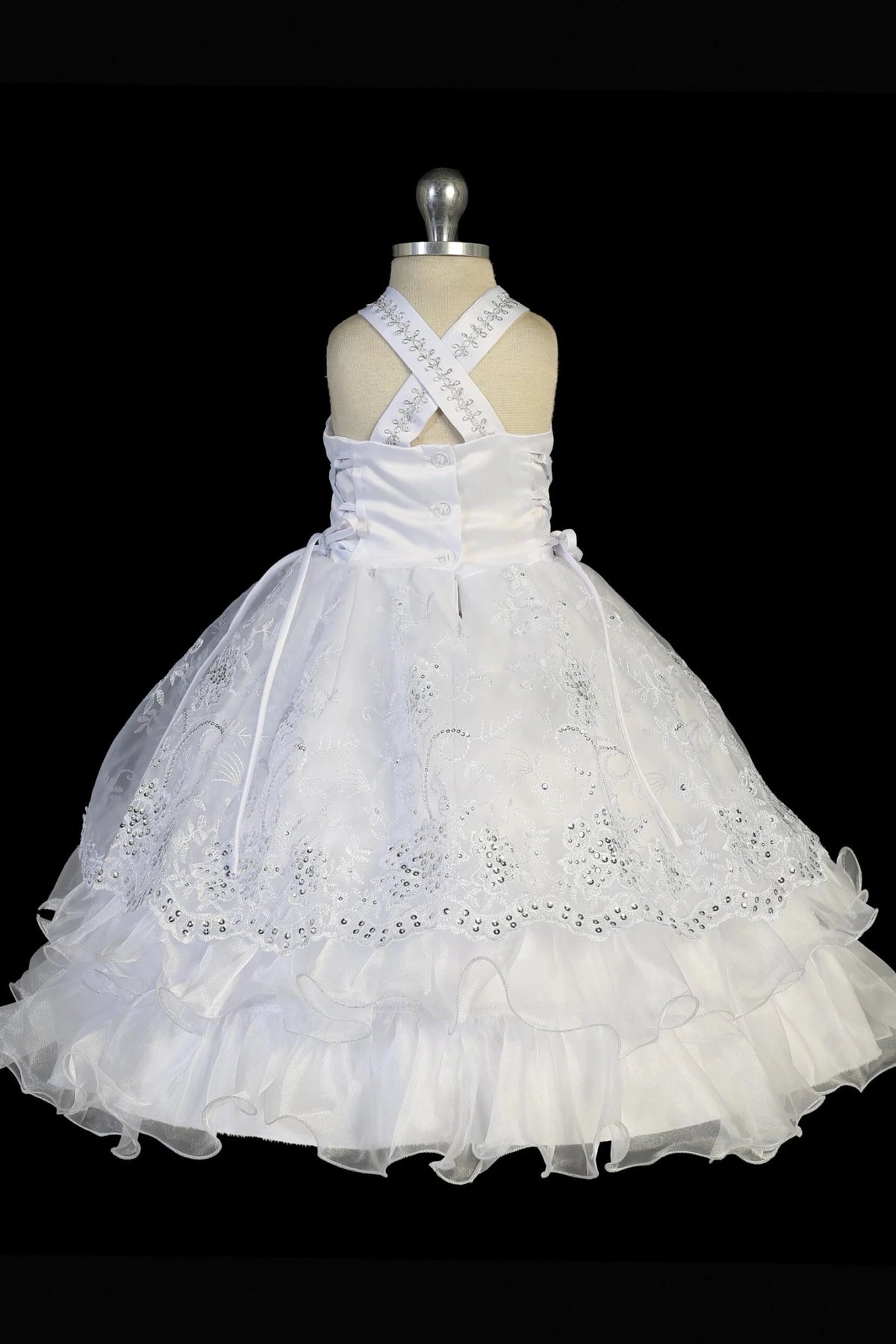 Back view of the White baptism dress showing crisscross back straps and ties.
