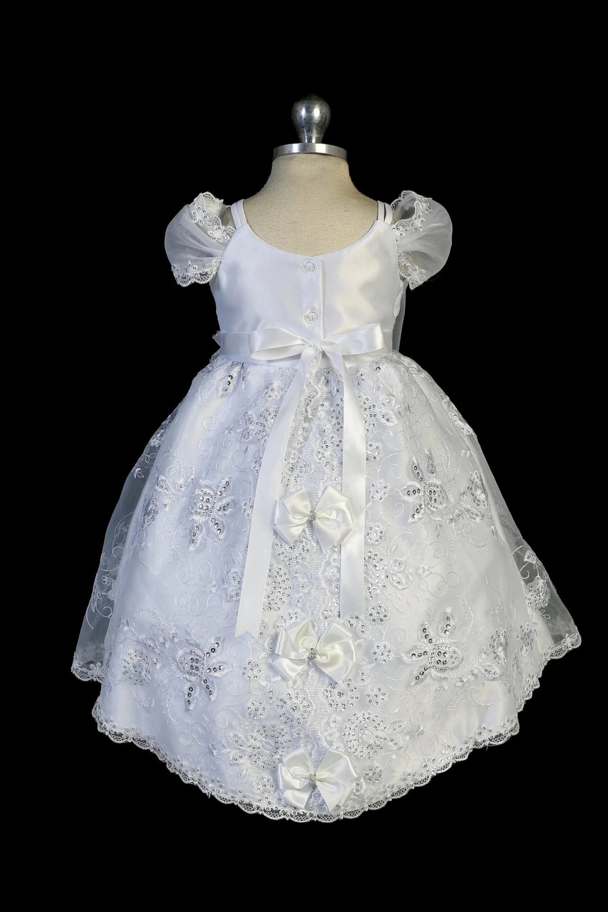 Back view of the White christening dress showing back lace detail and tie fastening.