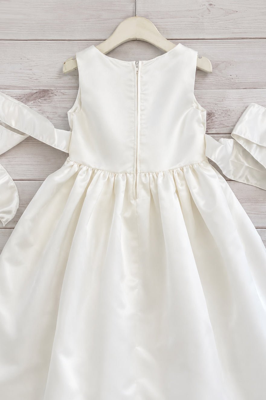 Ivory flower girl dress with back ribbon bow and zipper back. Also suitable as a communion dress. Also suitable as a baptism dress.