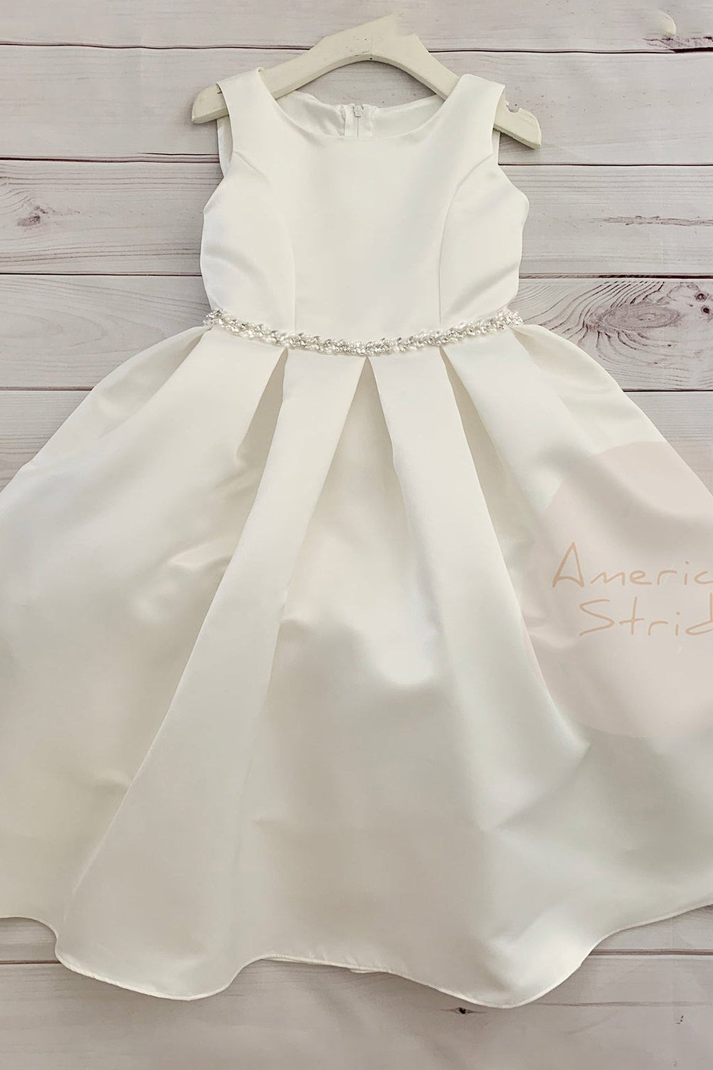 ivory satin flower girl dress with a rhinestone waistband.