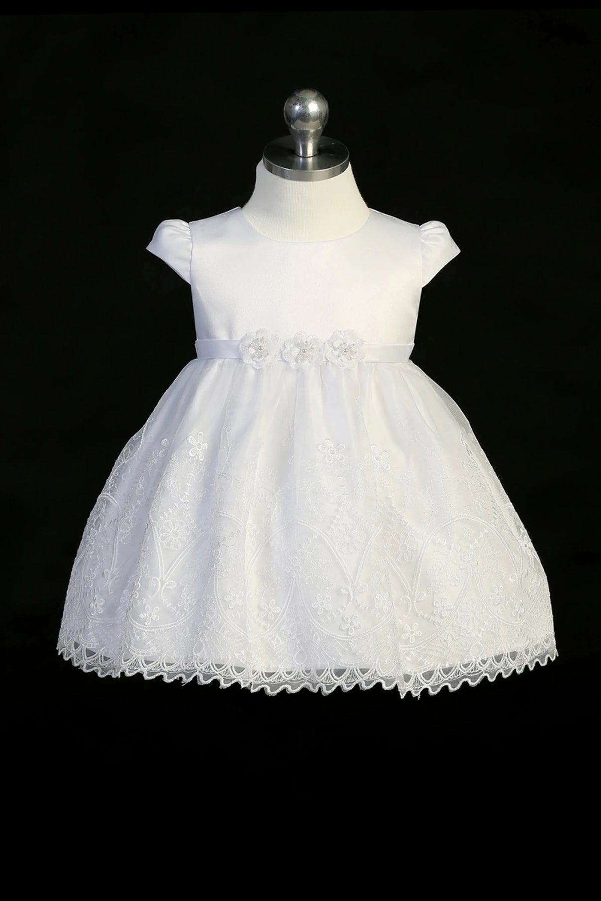 Back view of the White christening dress showing back bow and scalloped lace hem.