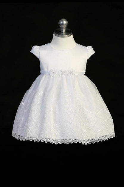 Back view of the White christening dress showing back bow and scalloped lace hem.