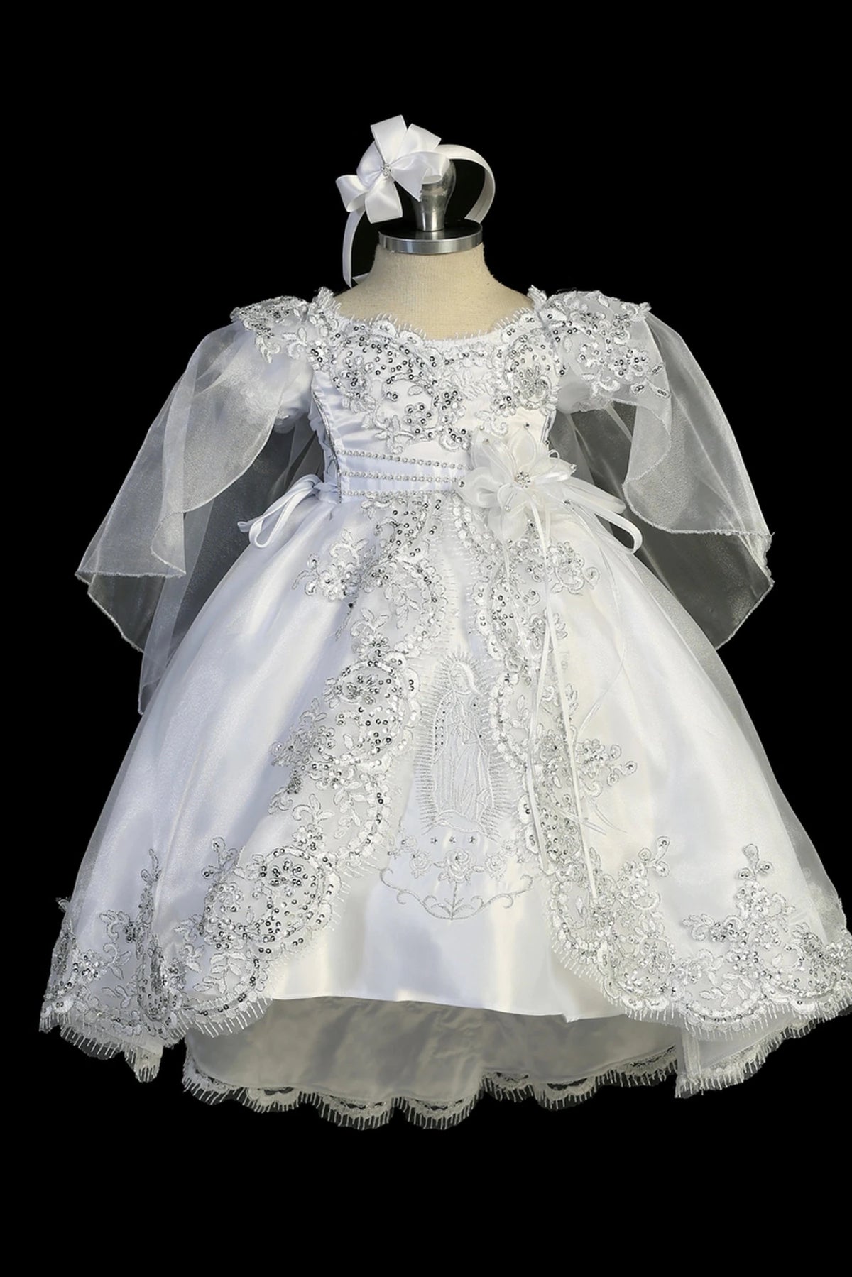 White baptism dress with boat neckline with metallic corded lace and sequins.
