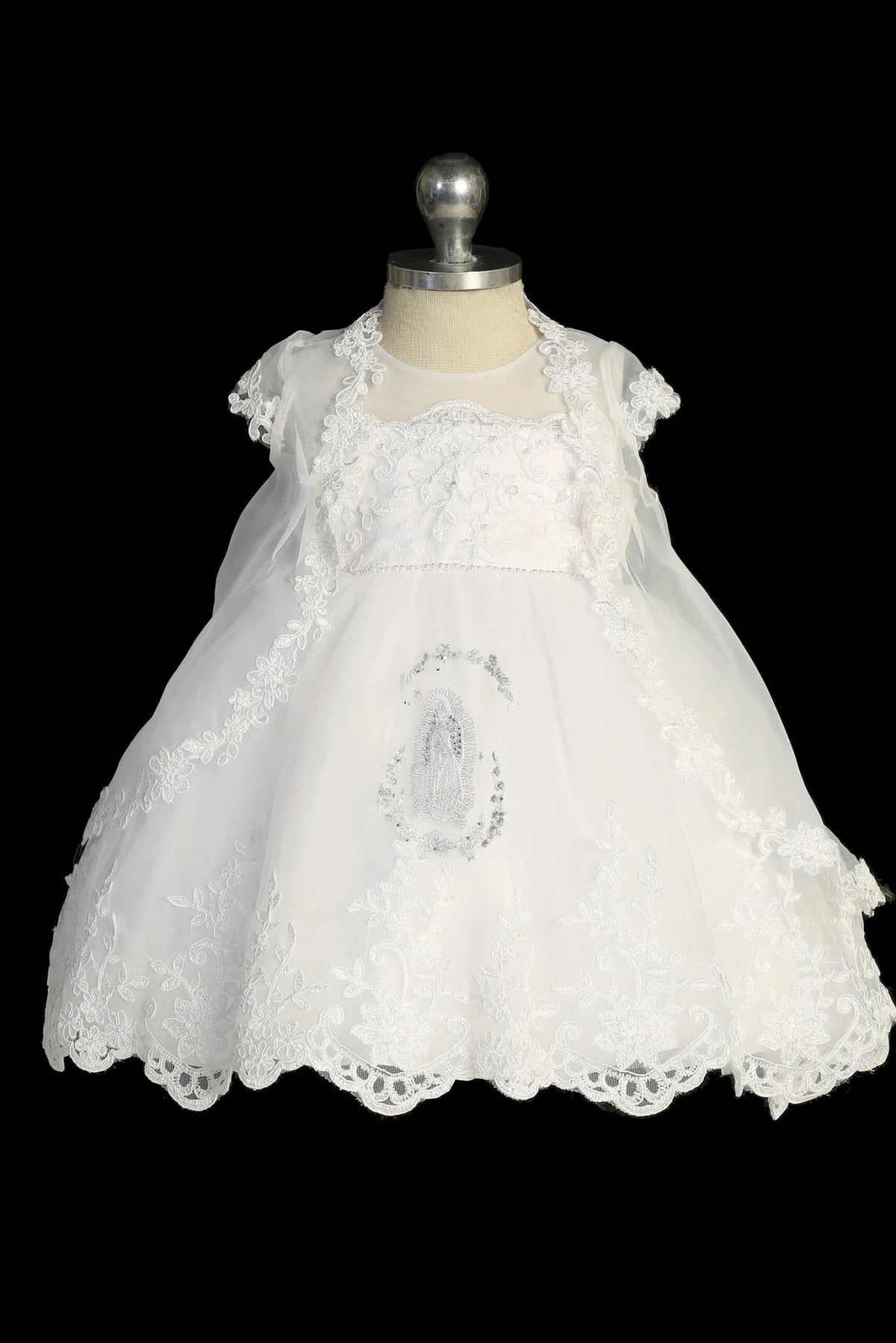 White baptism dress with illusion neckline and lace bodice.