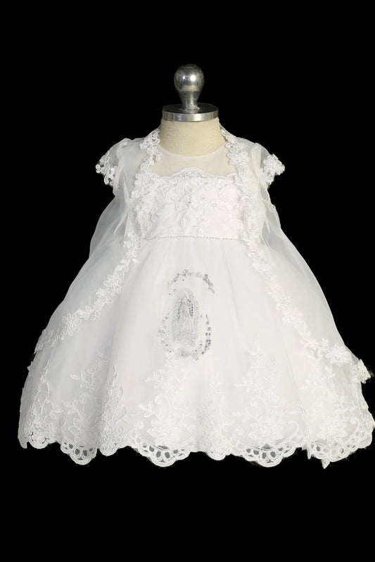 White baptism dress with illusion neckline and lace bodice.
