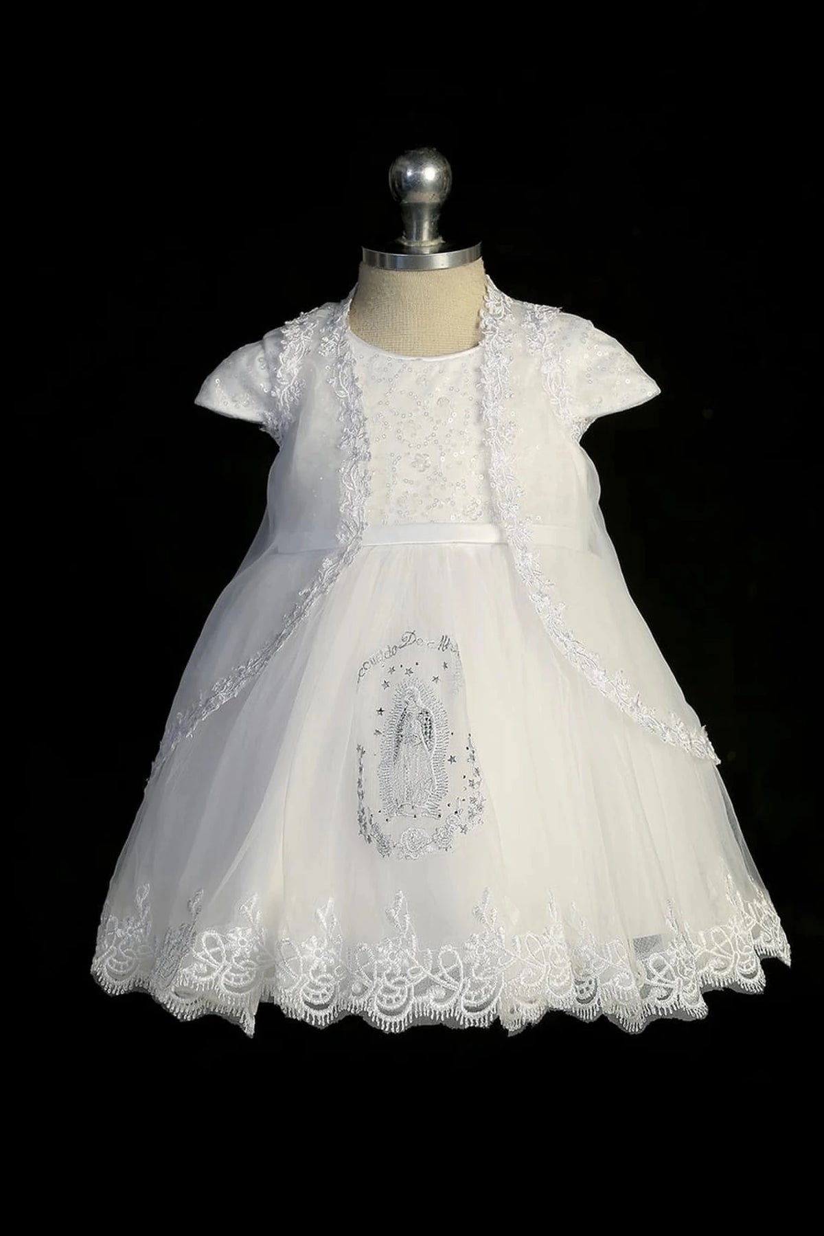 White baptism dress with cap-sleeved sequined bodice and a thin satin sash.