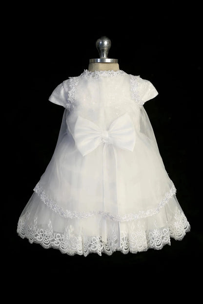 Back view of the White baptism dress showing satin waist bow at the back.