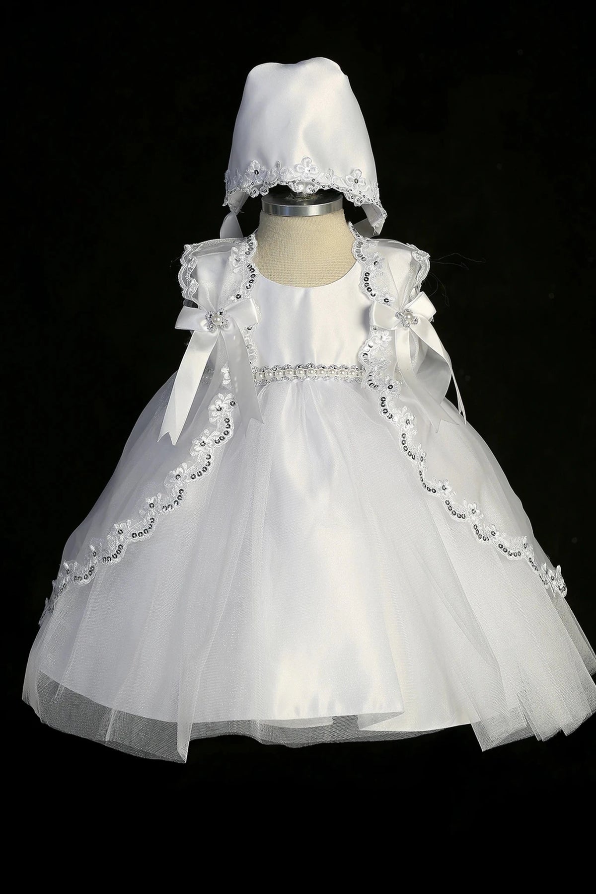 White christening dress with satin bodice with a pearl waist accent.