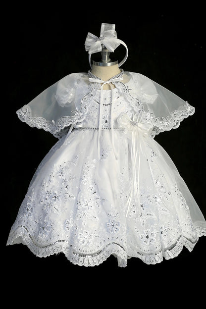 White christening dress with short-sleeved lace bodice.