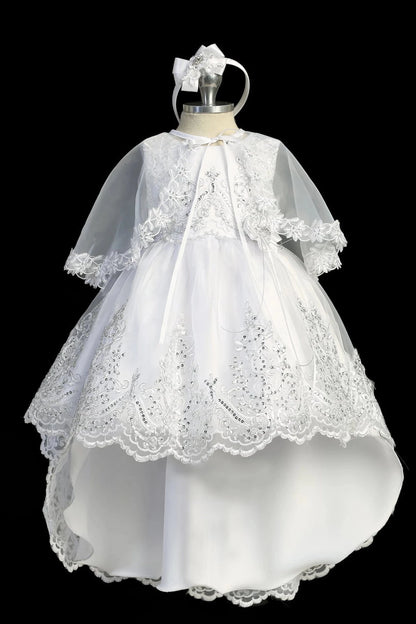 White baptism dress with metallic lace bodice with sequins and a removable bow.