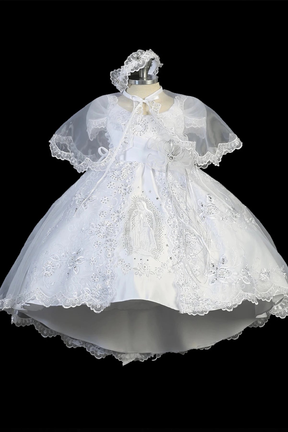 White baptism dress with short-sleeved lace bodice and a pleated waist.