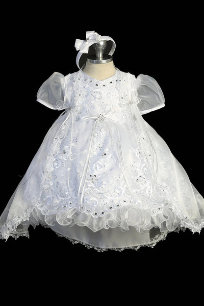White christening dress with puff sleeves and an organza-and-lace bodice.