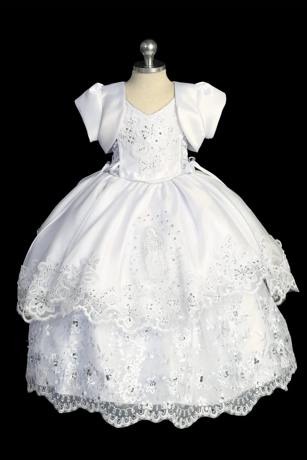 White baptism dress with satin-and-lace bodice and Virgin Mary skirt embroidery.