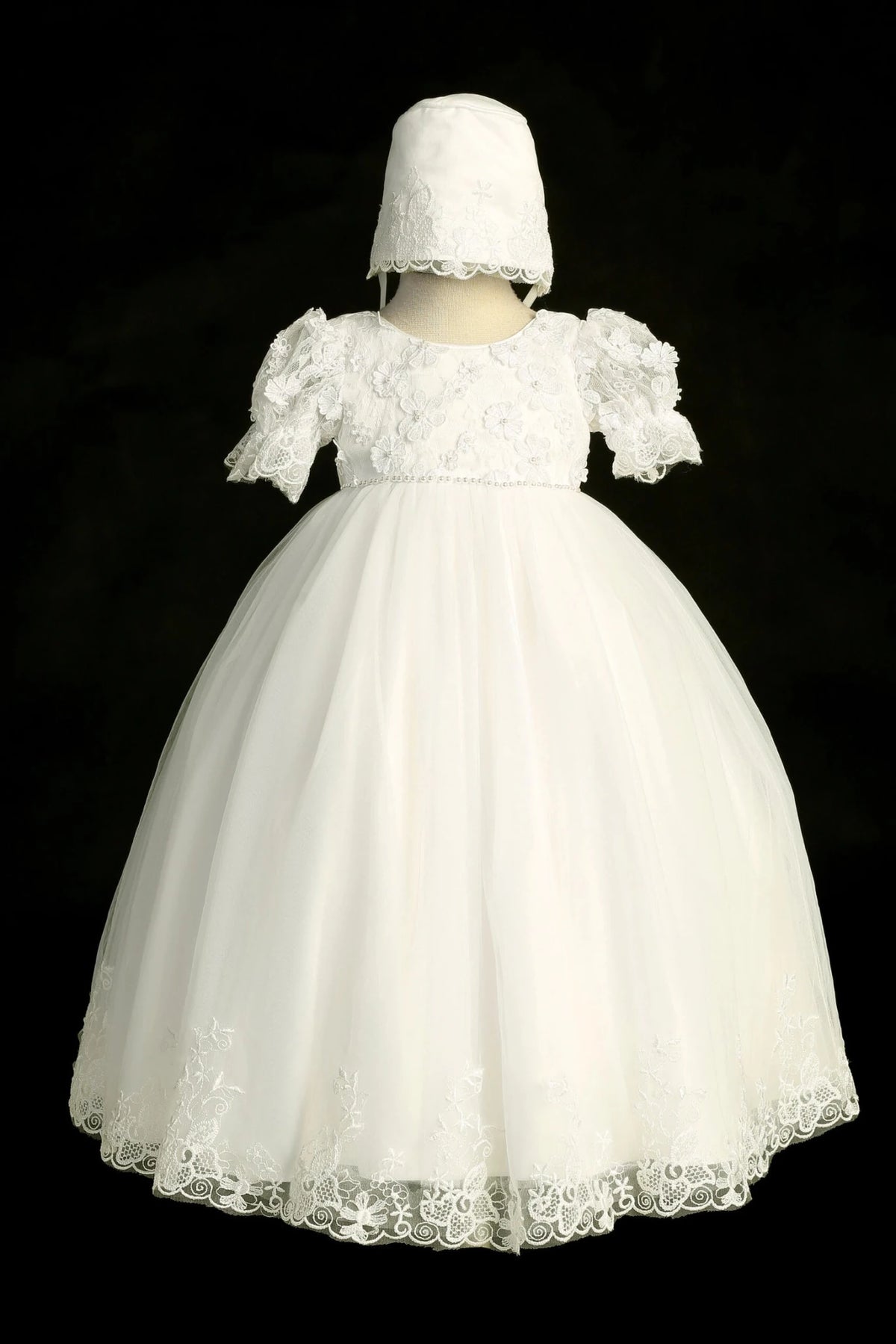 Ivory christening dress with puff-sleeved lace bodice with 3D flowers.
