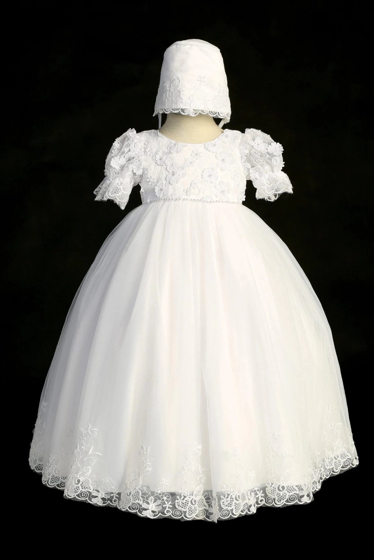 White christening dress with puff-sleeved lace bodice with 3D flowers.
