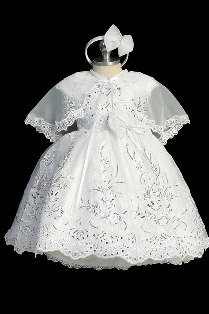 White christening dress with cap-sleeved lace bodice.