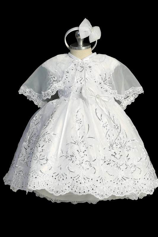 White christening dress with cap-sleeved lace bodice.