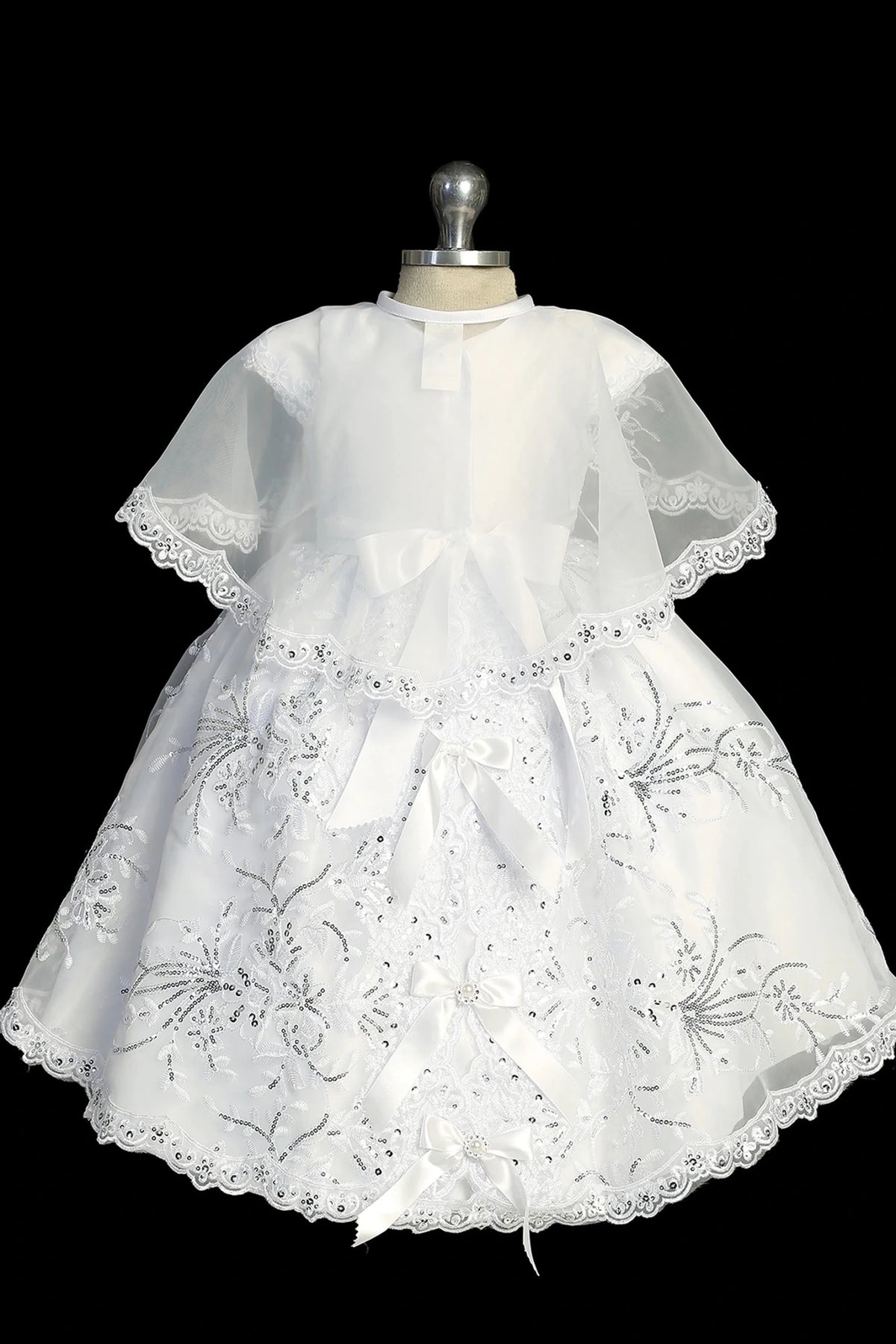 Back view of the White christening dress showing organza cape and back bow.