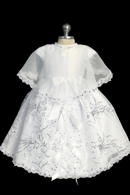 Back view of the White christening dress showing organza cape and back bow.