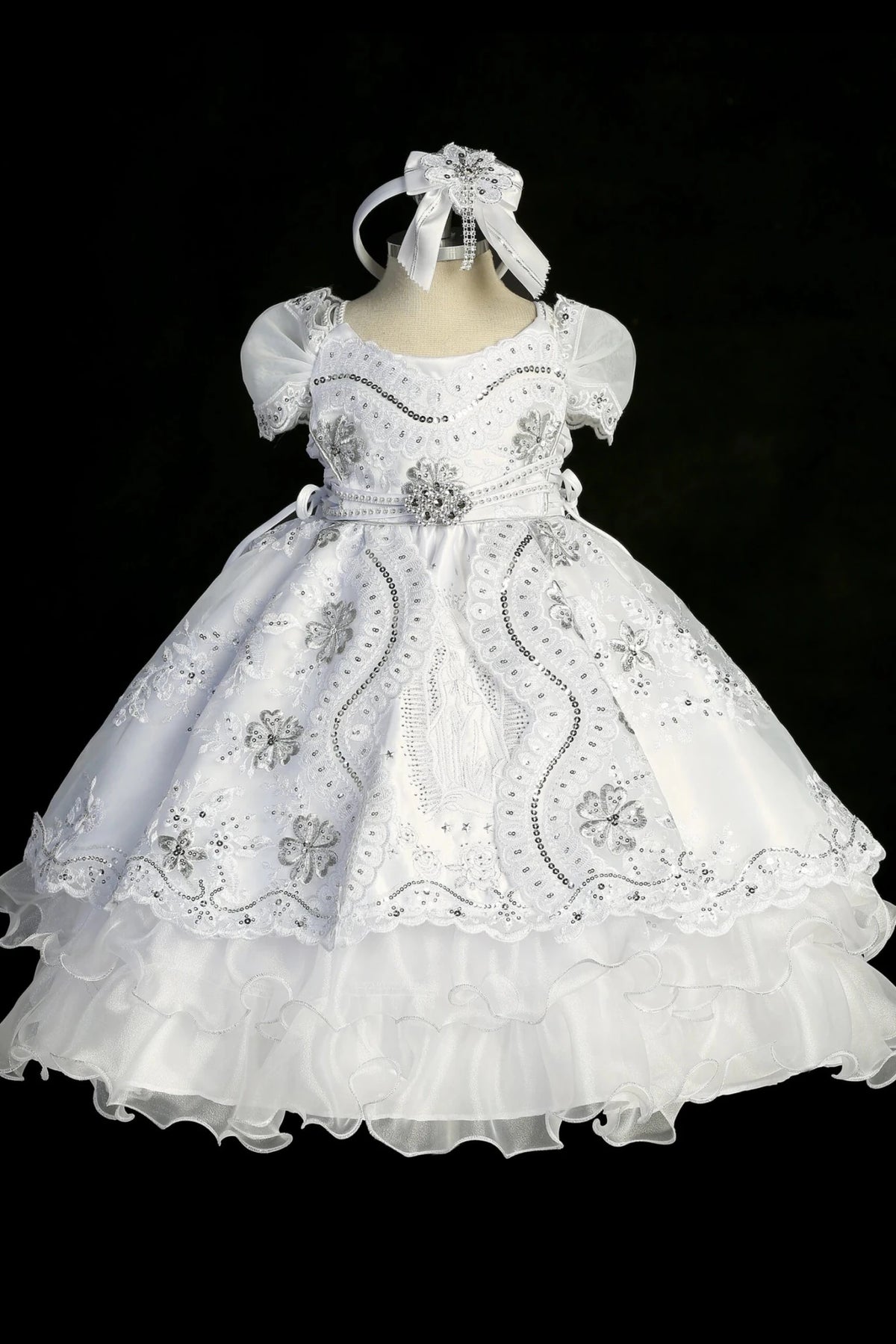 White baptism dress with sweetheart neckline with floral lace embroidery and sequins.
