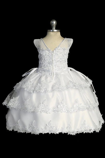 Another view of the white baptism dress with lace illusion neckline and a layered split skirt.