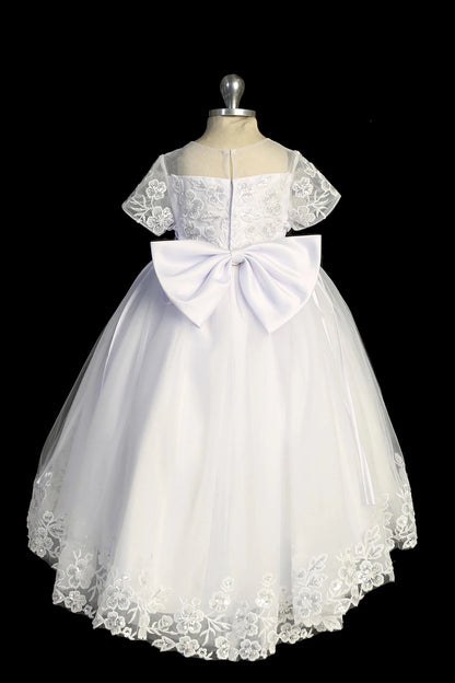 Back view of the White baptism dress showing large satin back bow and lace hem.