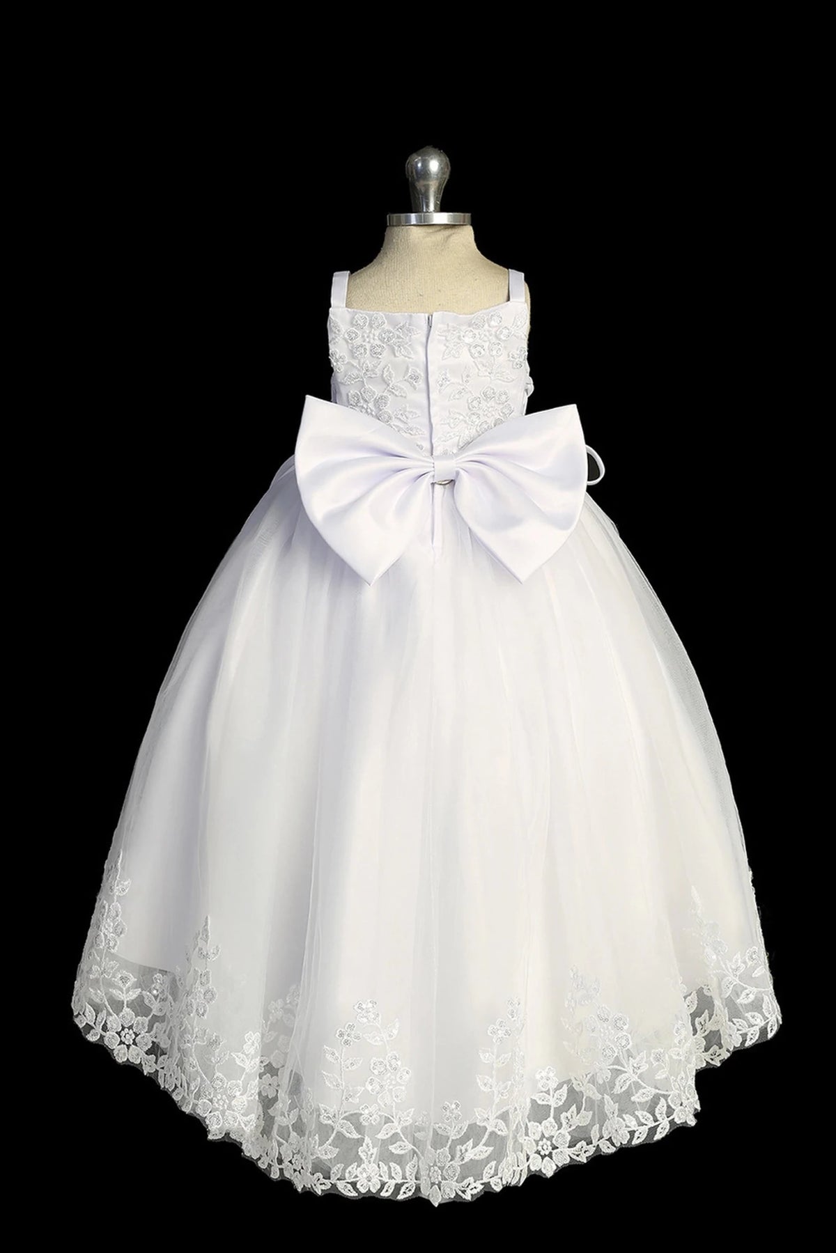 Back view of the White baptism dress showing large satin back bow and lace-trimmed hem.
