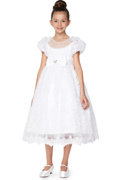 White communion dress with puff sleeves and a scalloped floral lace skirt border.