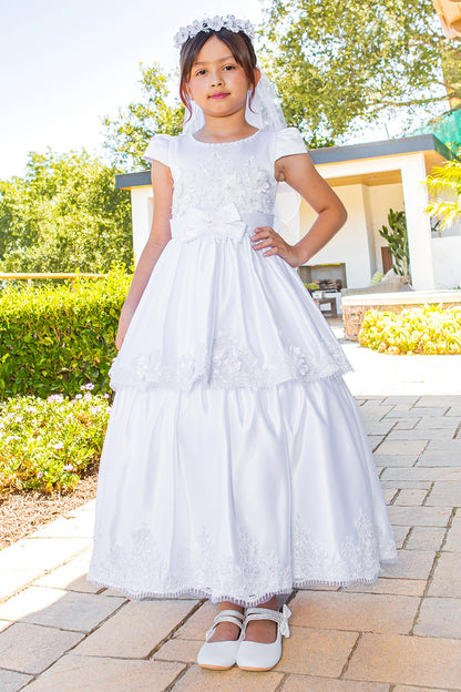 Elegant Illusion Top satin Cap Sleeve Embellished Skirt Communion Dress with Beads, Laces and Back Satin Sash - front view of girl wearing dress with one hand on hip