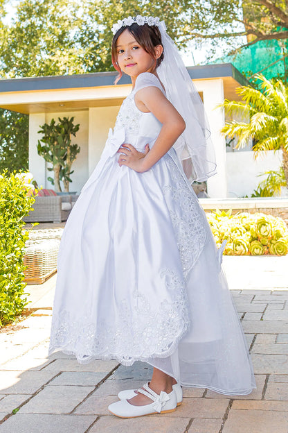 Scalloped floral lace edges the full skirt of this White communion dress.