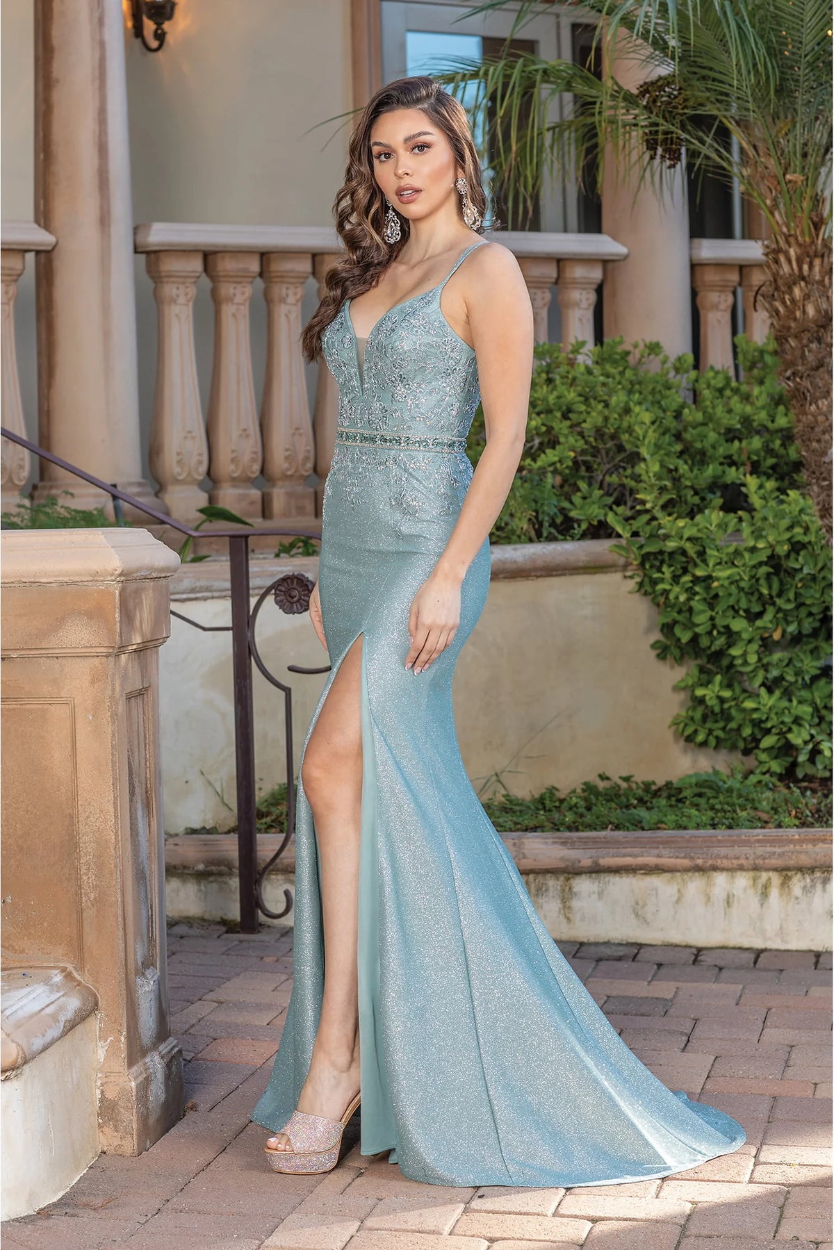 Featuring a floor-length skirt, this Dusty Green prom dress is shown in full view.