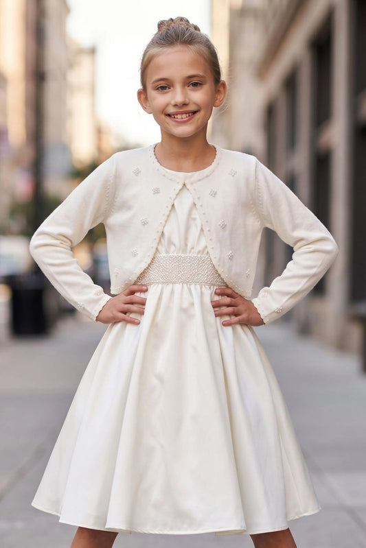 Featuring open front and embroidered edges, this Ivory pearl embroidered flower girl bolero jacket adds a layer over dresses.
