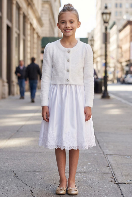 Featuring cropped silhouette and long sleeves, this White fuzzy flower girl bolero cardigan with jewel buttons adds a layer over dresses.