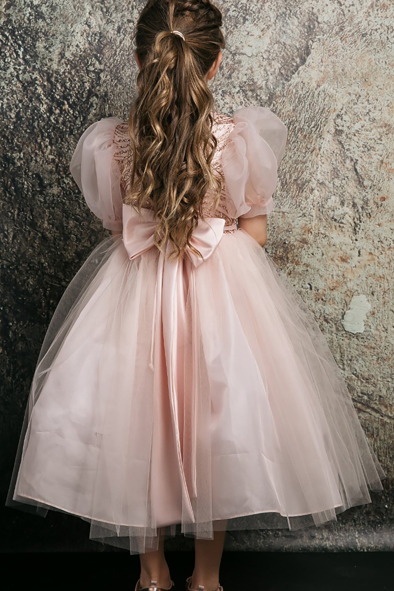 Back view of Blush Glittering Sequin bodice Tulle with Organza Bubble Sleeve Tea-length flower girl dress.