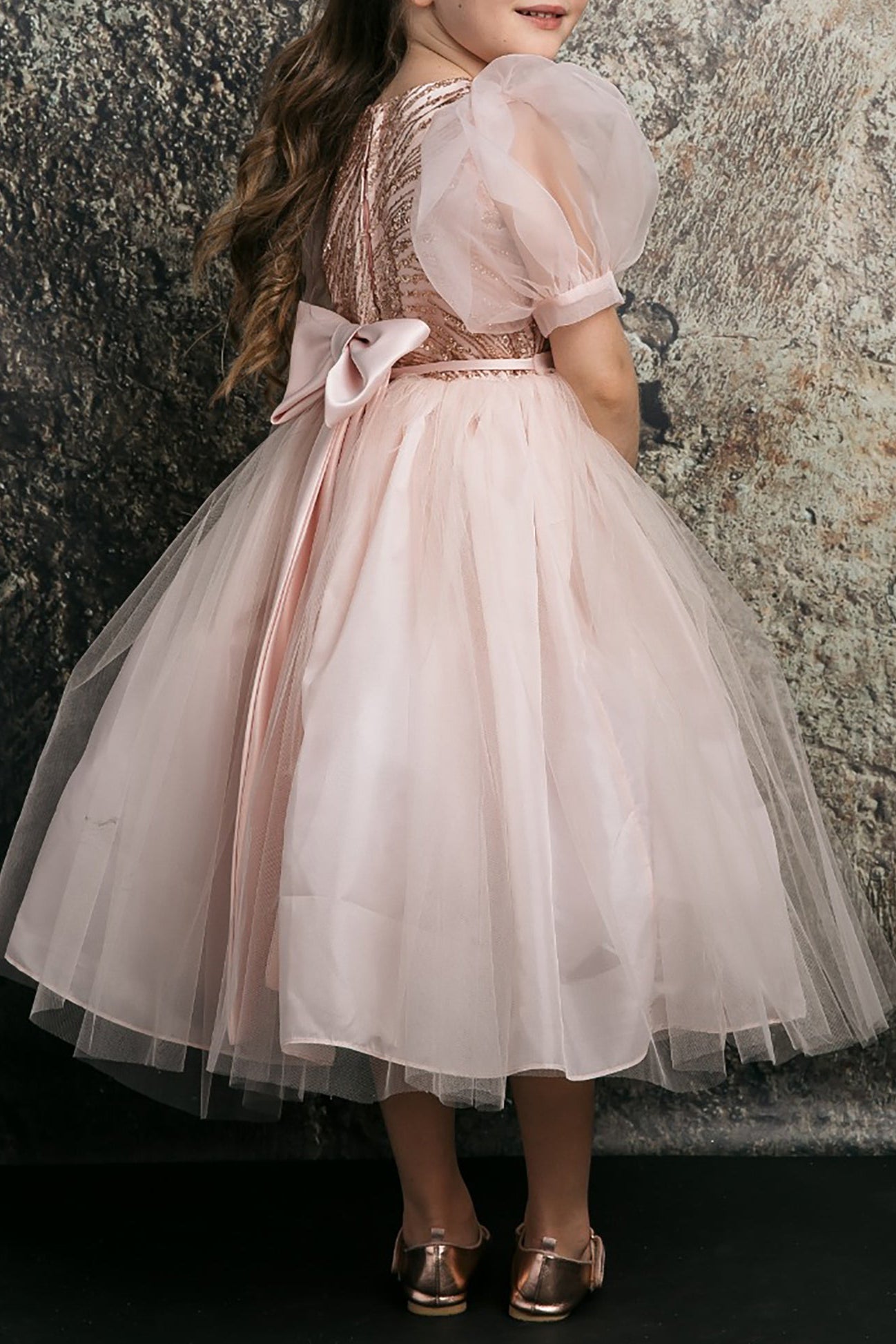 Close-up of Blush Glittering Sequin bodice Tulle with Organza Bubble Sleeve Tea-length flower girl dress.